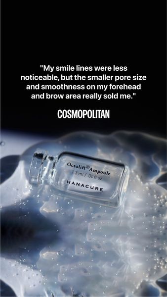 The ad is a vertical image ad. The background appears to be a stylized water or fluid effect. A small glass bottle of a skincare product sits in the foreground. Text in a quote format overlies the background image, with a review or testimonial from a 'Cosmopolitan' reviewer. The quote describes positive effects of the product on smile lines, pore size, forehead, and brow appearance.