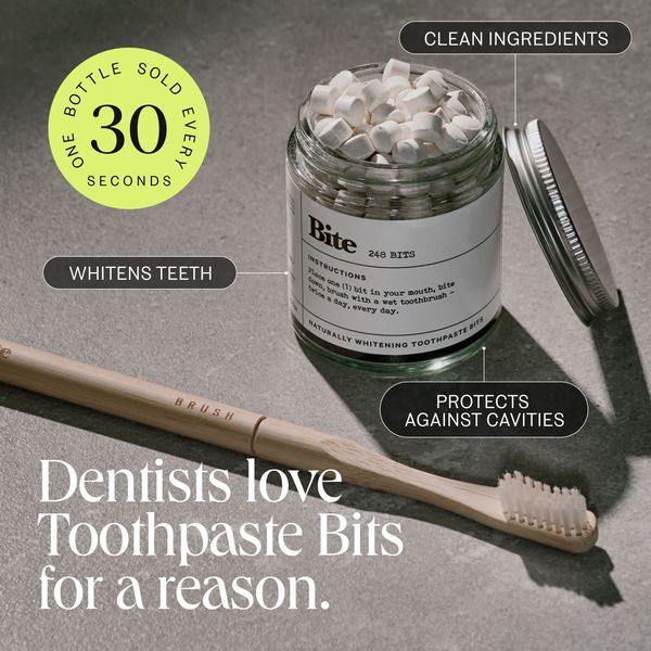 The image is a product shot featuring toothpaste bits and a bamboo toothbrush. A glass jar filled with white, cube-shaped toothpaste bits is the central focus, with an open silver lid beside it. The jar is labeled with text indicating the bit count and instructions. The bamboo toothbrush is placed near the jar. Text highlights key product features like whitening teeth, clean ingredients, and cavity protection displayed in separate callouts. A circular graphic states 'one bottle sold every 30 seconds.' The background is a light gray, and the overall layout is clean and modern.