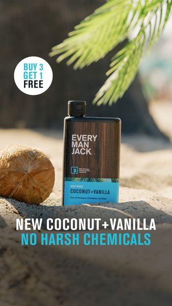 A product shot of a body wash bottle placed on a sandy beach background. The body wash bottle is a dark brown rectangle with a wooden texture. The product name is clearly visible, showcasing the "Coconut + Vanilla" scent, and the text "Free of Parabens, Phthalates, and Dyes". A callout bubble on the upper left corner promotes a "Buy 3 Get 1 Free" offer.