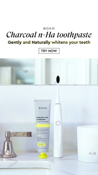 An advertisement featuring a minimalist bathroom setting. At the top is the ad's headline, and at the bottom, in the foreground, a tube of toothpaste, and a toothbrush are visible. The background includes a sink and a mirror, behind them.