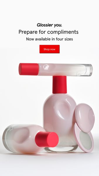 An advertisement featuring several pale pink bottles of perfume with red caps and a compact, all arranged on a white surface. The layout is clean and minimalist, with the bottles and compact displayed in a visually appealing manner. Above the fragrance bottles are the words "Prepare for compliments" and "Now available in four sizes", directing the user to shop now with a red bottom.