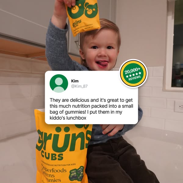 An advertisement featuring a young child holding up a package of gummies and smiling at the camera. The child is sitting on a countertop. A speech bubble with a customer review is overlaid on the image, showcasing the product benefits. There is also a badge indicating positive reviews.