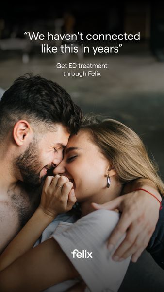 The image shows a couple intimately embracing each other. A man with a beard is leaning in, his face near the woman's face as she smiles. The woman has long, light brown hair and is wearing a white shirt with a silver earring. The lighting suggests a cozy indoor setting. Text overlays at the top reads, "We haven't connected like this in years." Below, smaller text reads, "Get ED treatment through [brand name]" The brand's logo is below the couple in white on a black background.