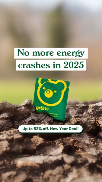 The ad features a close-up shot of a piece of dark, textured wood with a blurred green and brown natural background. On top of the wood, a small green packet with a bear-shaped logo containing a circle on the front is displayed. The package is slightly angled, adding some depth. Text overlays include the phrase "No more energy crashes in 2025" in white lettering and "Up to 52% off. New Year Deal!" in a rounded white box with a green outline.