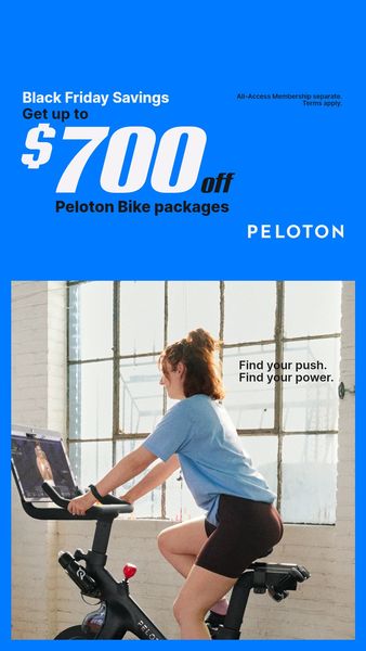 The ad is a vertical image with a blue background at the top that transitions into a lifestyle shot of a woman on a stationary bike. The top section includes text announcing "Black Friday Savings" with a discount of up to $700 on "Peloton Bike packages". There is also fine print stating "All-Access Membership separate. Terms apply." The lower portion shows a woman in activewear riding the bike, looking at the screen. The phrase "Find your push. Find your power." is written in the bottom right. The brand's logo is placed at the bottom right.