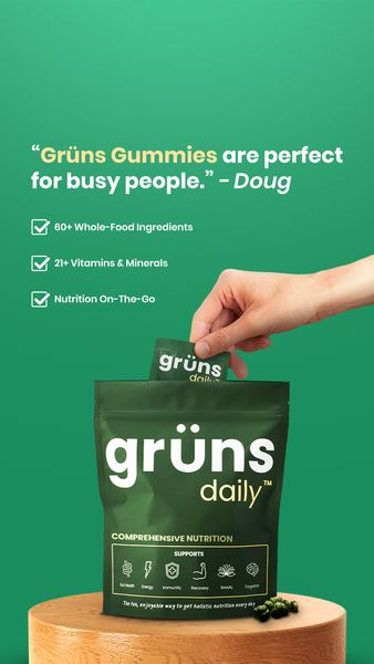 An ad featuring a green background. The top left corner has a customer quote. In the center is a supplement bag with a hand extracting a supplement packet. The bag stands on a small, wooden display. The text states the gummies are perfect for busy people, and include whole-food ingredients.