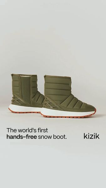 The image showcases a pair of olive-green snow boots set against a clean, white background. The boots are the central focus, with a modern and sleek design. The text "The world’s first hands-free snow boot." is displayed below the boots, emphasizing the product's key selling point. The composition is simple, with the boots taking up most of the space, and the text complements the visual presentation. Logo of the brand is in the lower right corner.