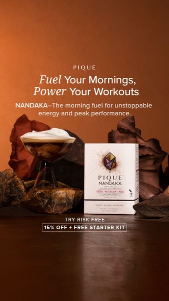 The ad is a vertical image with a warm, earthy color scheme. In the top section, it highlights text that reads “Fuel Your Mornings, Power Your Workouts”, along with the tagline “The morning fuel for unstoppable energy and peak performance.” The central visuals include a stylish glass with a creamy beverage, arranged with rocks. To the right, a product box reveals the product called 'NANDAKA'. The bottom portion showcases an offer: 'TRY RISK FREE' with '15% OFF + FREE STARTER KIT'.