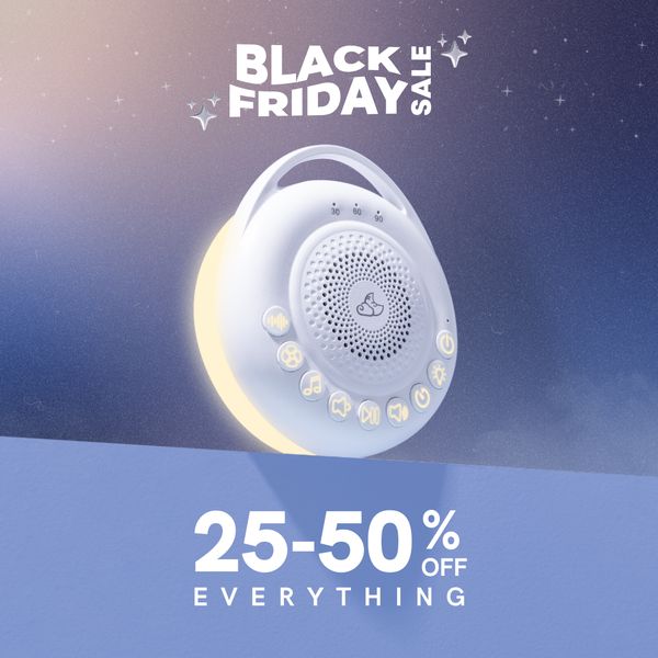 An ad featuring a white baby sleep sound machine with a soft glowing light and multiple button icons. The ad is set against a gradient blue background imitating a night sky. Text at the top reads, "BLACK FRIDAY SALE". Below the product, the ad displays the sale details, "25-50% OFF EVERYTHING".