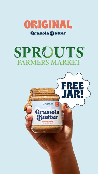 The ad features a light-blue background. At the top, it displays the word "ORIGINAL" in an orange font, with "Granola Butter" in a dark blue font beneath it. Below this, in green, are the words "SPROUTS" and "FARMERS MARKET". The focal point is a hand holding a jar of Granola Butter. A white speech bubble with the text "FREE JAR!" in dark blue is in the upper right corner. The jar is overflowing with granola butter, suggesting a generous serving. The overall layout is clean and appealing, highlighting the product.