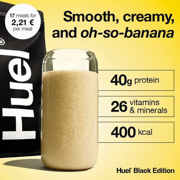 The ad features a glass of creamy banana-flavored shake in a clear glass, sitting in front of a black bag that is partially visible on the left side. Text on the bag reads “17 meals for 2,21€ per meal”. To the right of the shake, there are three boxes with descriptive texts: “40g protein”, “26 vitamins and minerals”, and “400 kcal”. The background fades from a light yellow at the bottom to a brighter yellow at the top. The text at the top reads "Smooth, creamy, and oh-so-banana", while the Black edition tagline is written at the bottom.