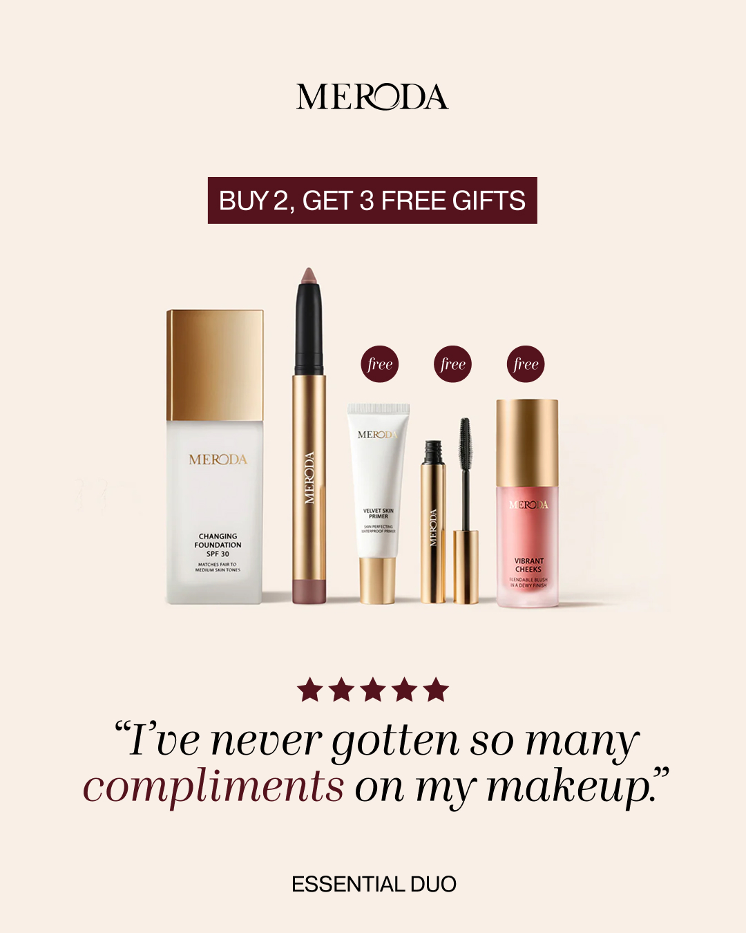 A product shot displays a collection of Meroda cosmetics, including foundation, lipstick, primer, mascara, and blush, arranged against a neutral background. Above the products, the brand name "MERODA" is prominently displayed. A burgundy banner across the top reads "BUY 2, GET 3 FREE GIFTS." Below the product arrangement, a five-star rating is shown, followed by a customer testimonial in elegant script: "I've never gotten so many compliments on my makeup." At the bottom, the text "ESSENTIAL DUO" is centered.
