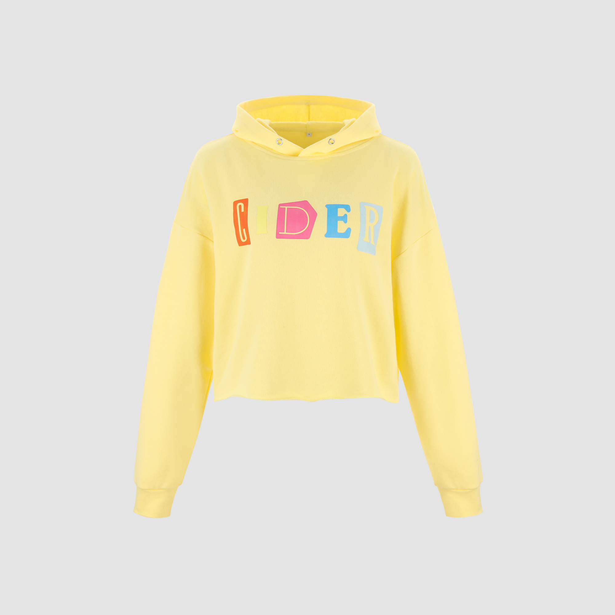 A bright yellow cropped hoodie with the word "CIDER" spelled out in colorful, blocky letters across the chest. The letters are in shades of orange, yellow, pink, and blue. The hoodie is shown against a plain grey background. The text "Get 15% off EVERYTHING for new users on the Cider app🎉" is overlaid on the image.