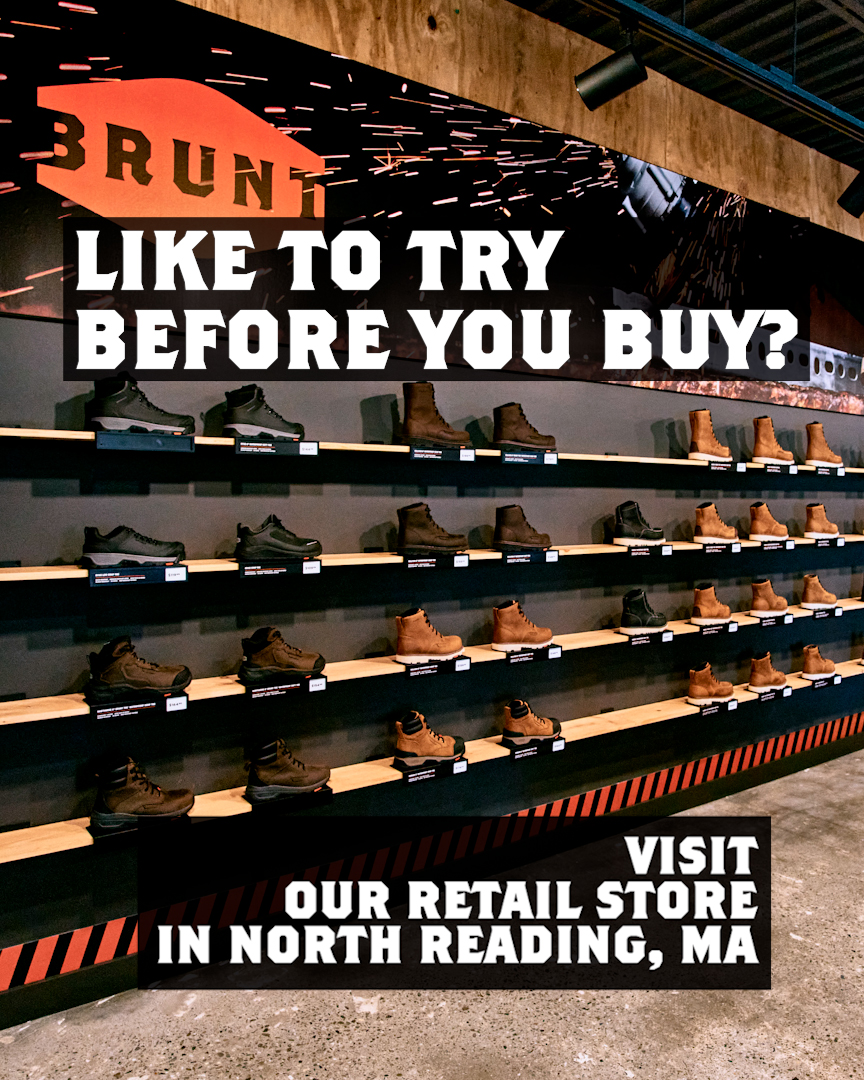 The creative displays rows of work boots on shelves in a retail store. The top of the image features the BRUNT logo and the text "LIKE TO TRY BEFORE YOU BUY?". The bottom of the image has a black banner with orange and black diagonal stripes on the left, and white text on the right that reads "VISIT OUR RETAIL STORE IN NORTH READING, MA".