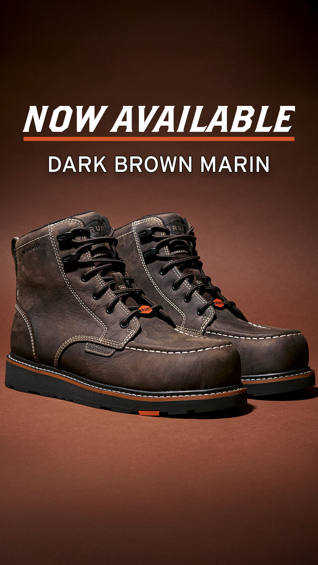A pair of dark brown leather work boots are displayed against a solid brown background. White stitching accents the boots, and orange details are visible on the soles and laces. The text "NOW AVAILABLE" is prominently displayed in white, bold, sans-serif font across the top of the image, with an orange line underneath. Below this, the text "DARK BROWN MARIN" is shown in white, smaller font.