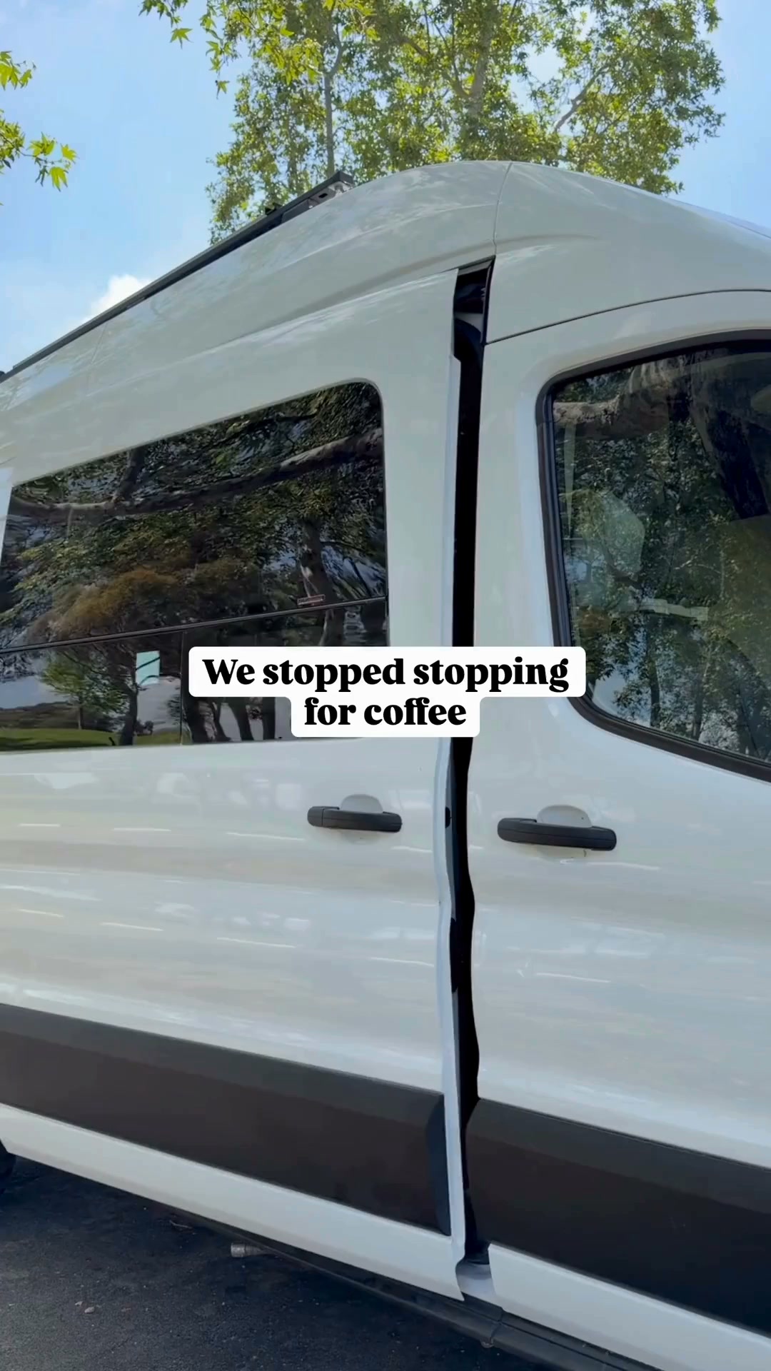 The creative shows the side of a white van with tinted windows, parked outdoors under trees. The doors of the van are slightly ajar. White text on a black background overlay reads, "We stopped stopping for coffee." The image captures a moment of travel or a mobile lifestyle, suggesting a change in routine related to coffee consumption.