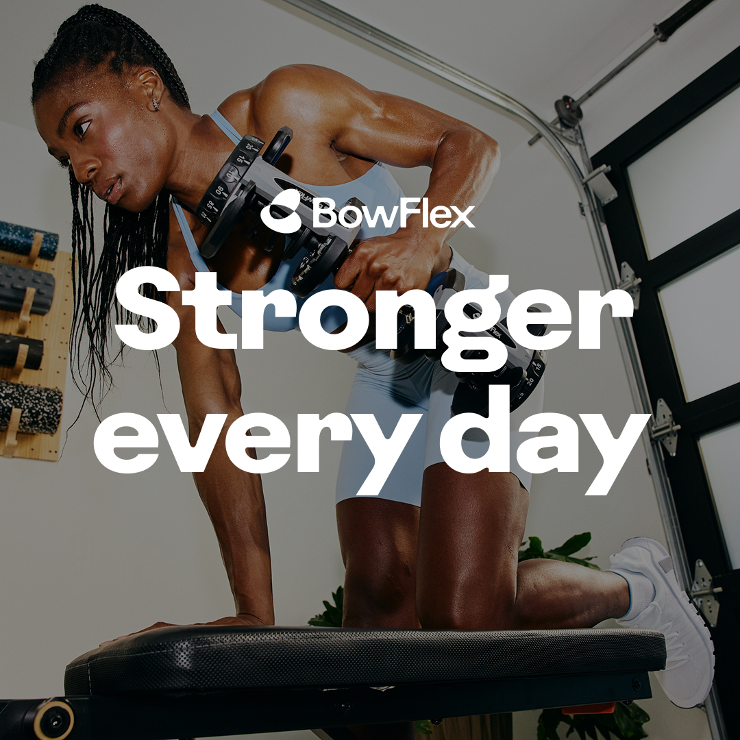 A woman is shown performing a dumbbell row exercise on a weight bench in what appears to be a home gym. She is focused and determined, with sweat visible on her skin. The BowFlex logo is present in the upper right corner. Large white text overlays the image, reading "Stronger every day." The overall impression is one of strength, dedication, and personal achievement through fitness.