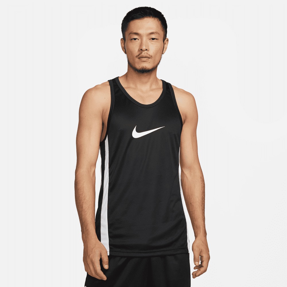 A man stands against a white background wearing a black Nike tank top with a white Nike swoosh logo on the chest and white stripes on the sides. The text "Bring sports more fully into your day with the Nike App." is overlaid on the image. The man is looking directly at the camera with a neutral expression.