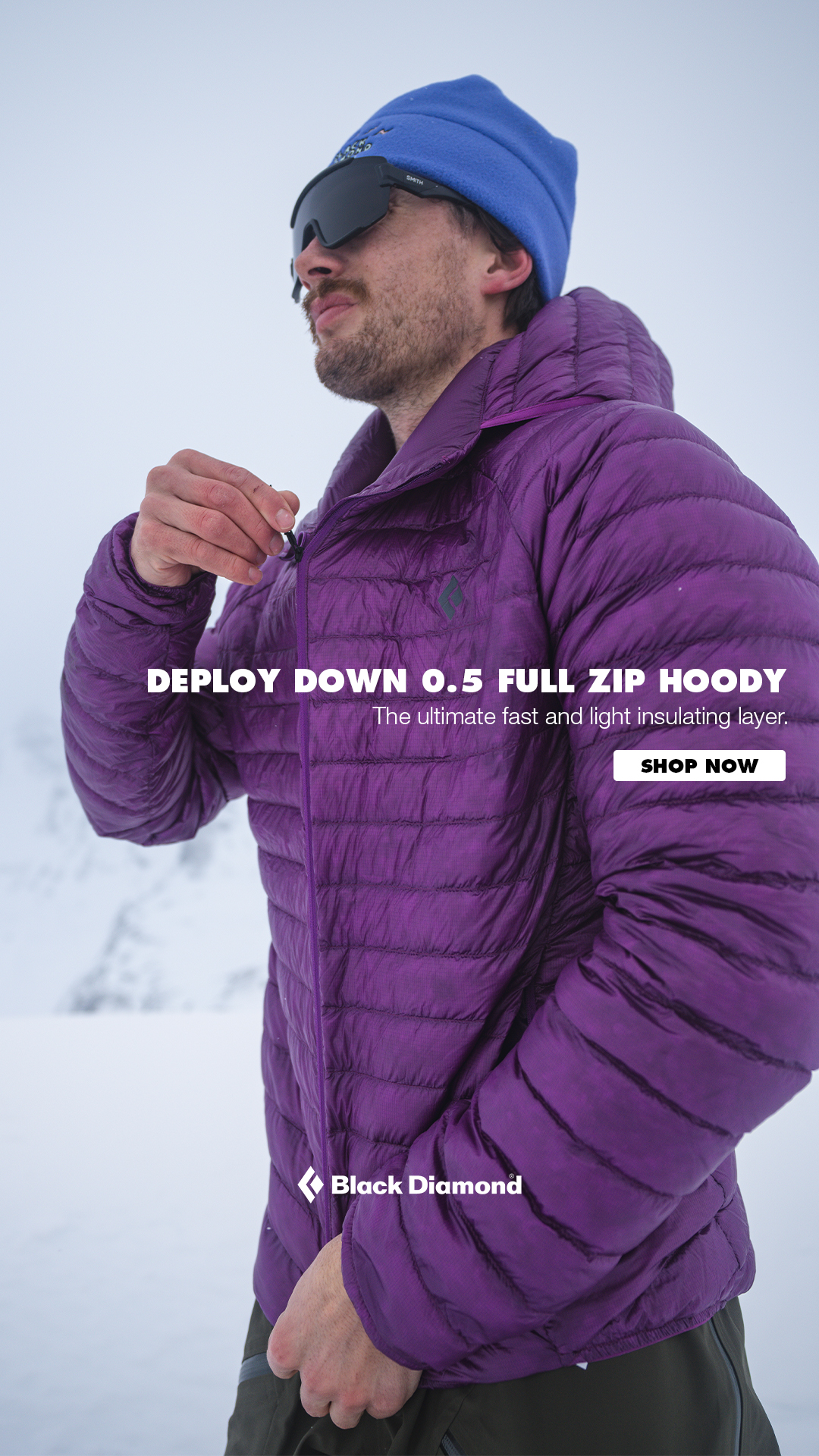 A man wearing a purple hooded jacket and a blue beanie is shown from the chest up, looking to the side. The jacket is zipped up, and the man is adjusting the zipper pull. Text overlay on the image reads "DEPLOY DOWN 0.5 FULL ZIP HOODY" and "The ultimate fast and light insulating layer." A "SHOP NOW" button is also visible on the right side of the image. The Black Diamond logo appears at the bottom center of the jacket.