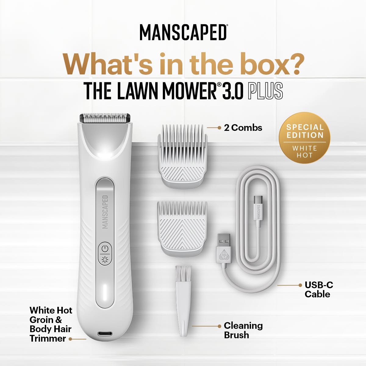 The image displays the contents of a Manscaped Lawn Mower 3.0 Plus White Hot special edition box. The main item, a white trimmer, is shown on the left, with labels pointing to two comb attachments, a USB-C charging cable, and a cleaning brush. Text at the top reads "MANSCAPED" and "What's in the box? THE LAWN MOWER® 3.0 PLUS". A circular badge on the right highlights "SPECIAL EDITION WHITE HOT".