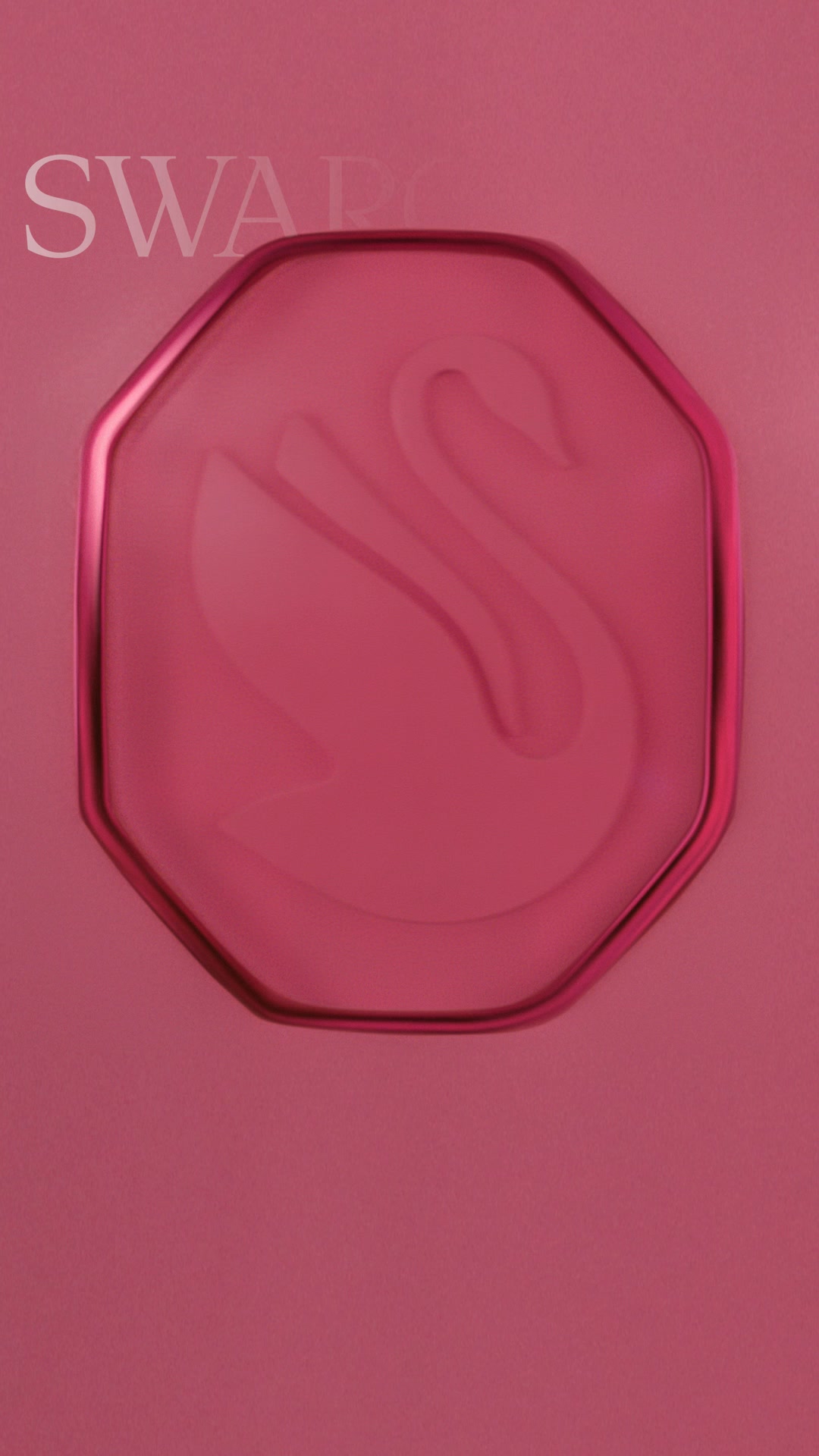 The ad features a close-up of a pink, octagonal Swarovski crystal with the brand's swan logo embossed on it. The background is a solid pink gradient. The text "SWARO" is subtly visible in the upper left corner. The overall aesthetic is luxurious and elegant, focusing on the iconic Swarovski design. The copy, "Return to the party of your dreams with Ariana Grande," suggests a connection to glamour and celebrity.