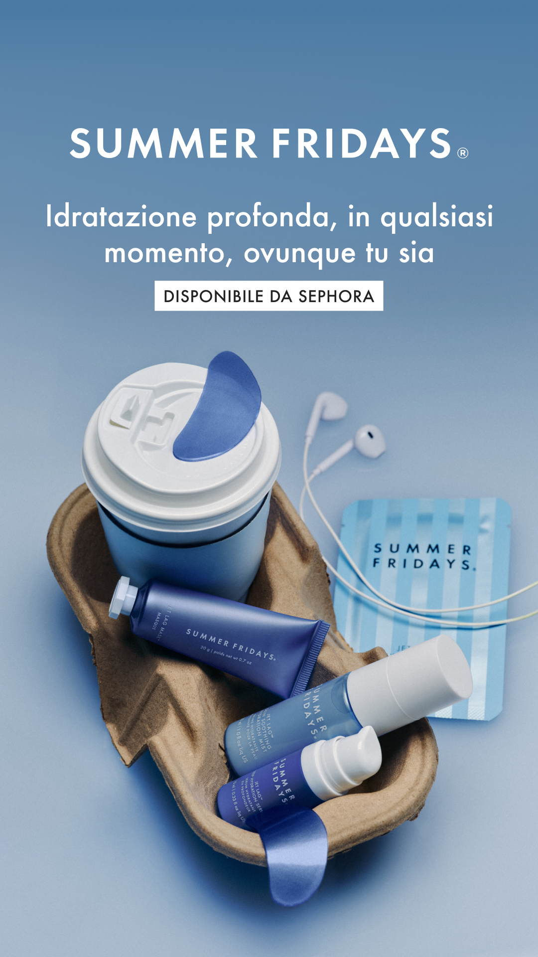 The ad features a collection of Summer Fridays skincare products arranged in a brown cardboard tray, resembling a coffee cup holder. A white travel mug with a blue lid is placed in the center, with a blue eye mask peeking out. Various Summer Fridays branded tubes and bottles are nestled around the mug. The background is a solid light blue. White text overlays the image, with the brand name "SUMMER FRIDAYS" at the top, followed by the hook "Idratazione profonda, in qualsiasi momento, ovunque tu sia" and a call to action "DISPONIBILE DA SEPHORA" in a white box. The overall aesthetic suggests on-the-go hydration and skincare.