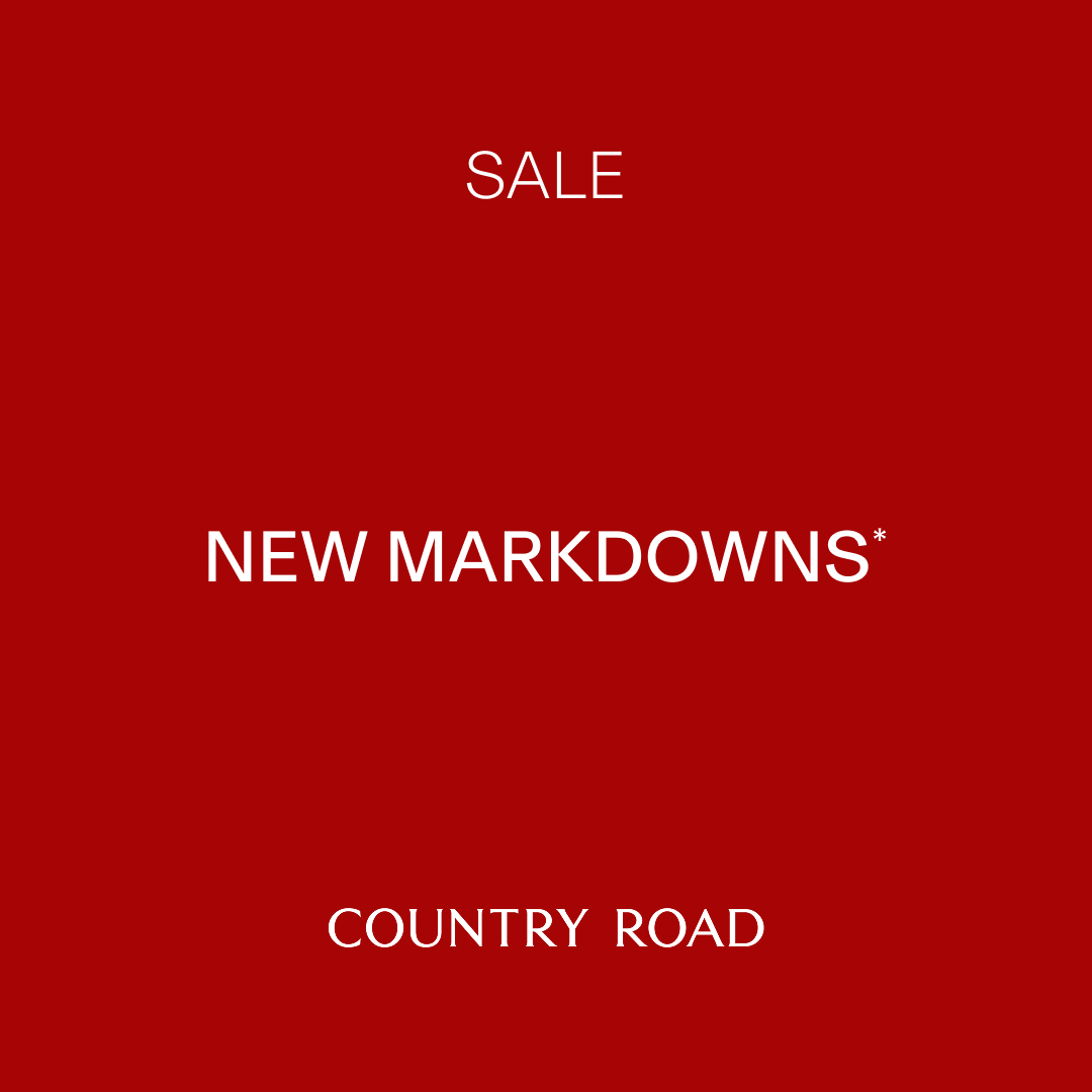 The creative is a solid red background with white text. The top of the screen reads "SALE". Below that, in larger font, it says "NEW MARKDOWNS*". At the bottom of the screen, it reads "COUNTRY ROAD". The text "SALE" acts as the hook, immediately informing the viewer of a sale event.
