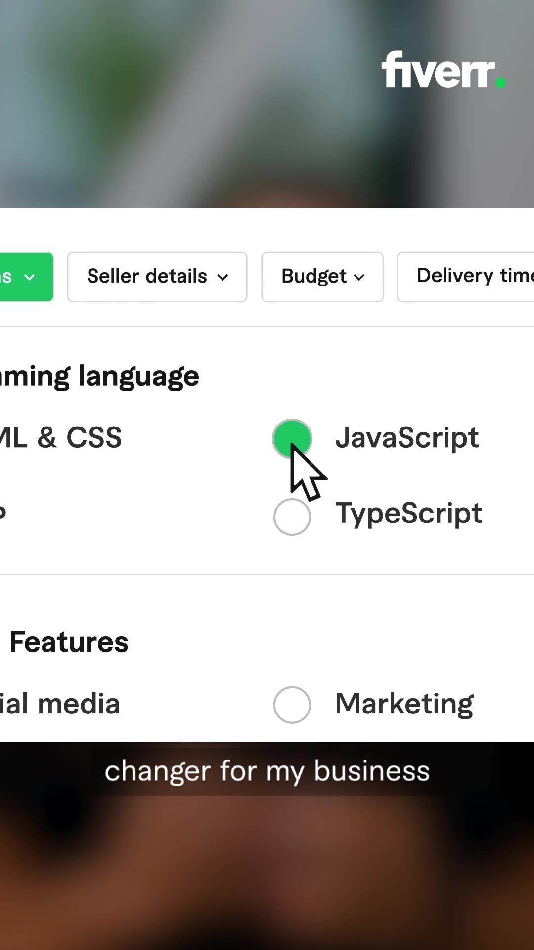 A screen recording shows a Fiverr interface with various filters and options. The cursor hovers over a "Programming language" filter, with options like "HTML & CSS" and "JavaScript" visible. A green circle highlights the "JavaScript" option. Below, a "Features" section shows "Social media" and "Marketing" as choices. A text overlay at the bottom reads "changer for my business."