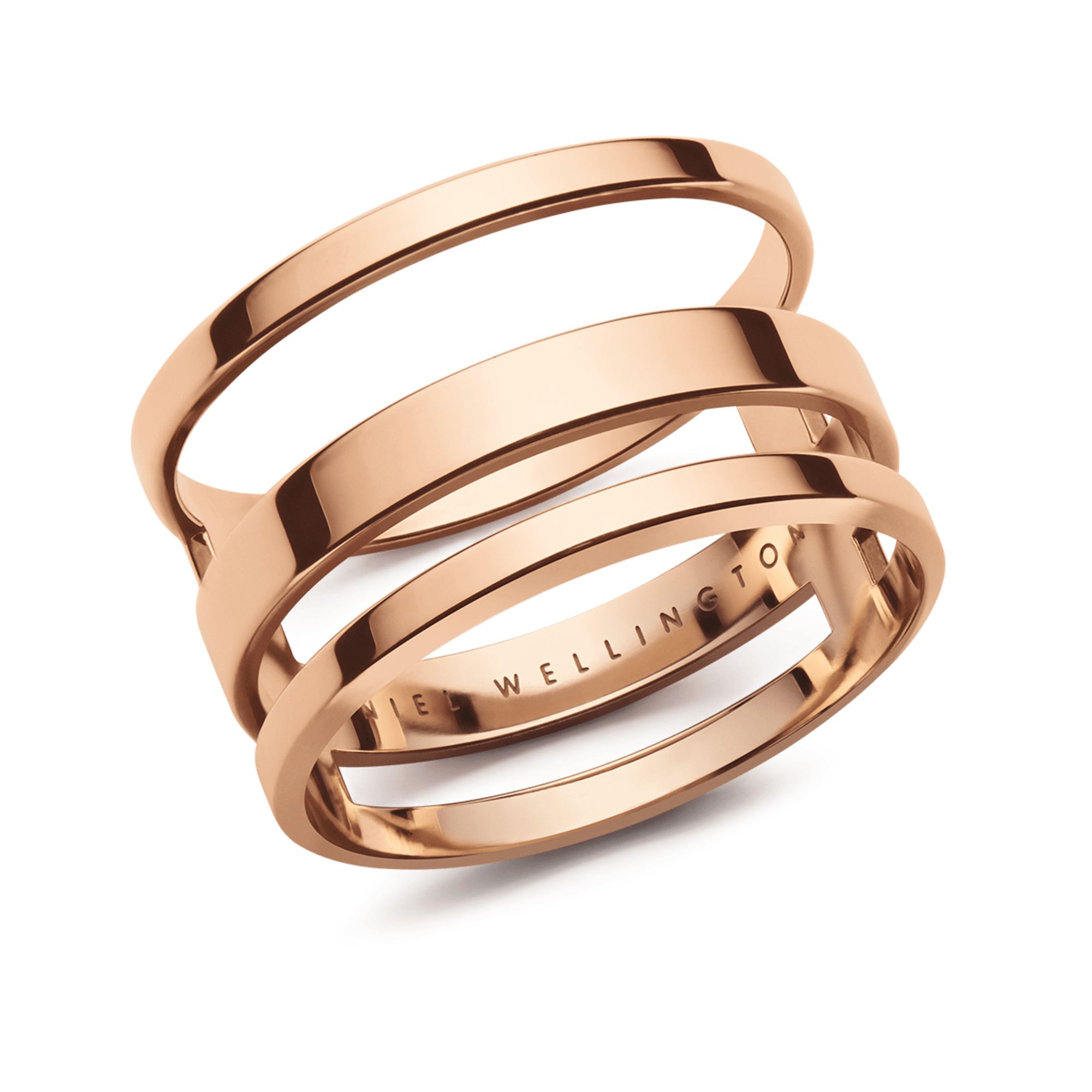 A close-up studio shot of a rose gold ring with multiple intertwined bands. The brand name "DANIEL WELLINGTON" is subtly embossed on the inner surface of one of the bands. The text "Conçu à la perfection" is overlaid on the image, highlighting the meticulous design and craftsmanship of the jewelry.