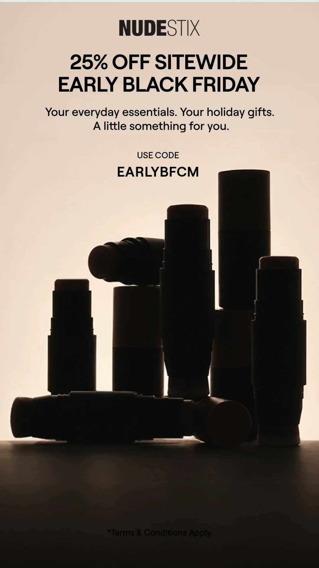 The ad features a silhouette of several Nudestix products arranged in a cluster against a light background. The brand logo, NUDESTIX, is displayed at the top. Bold text announces "25% OFF SITEWIDE EARLY BLACK FRIDAY" and provides a "USE CODE EARLYBFCM". Below the code, smaller text reads, "Your everyday essentials. Your holiday gifts. A little something for you." The bottom of the ad includes "*Terms & Conditions Apply."