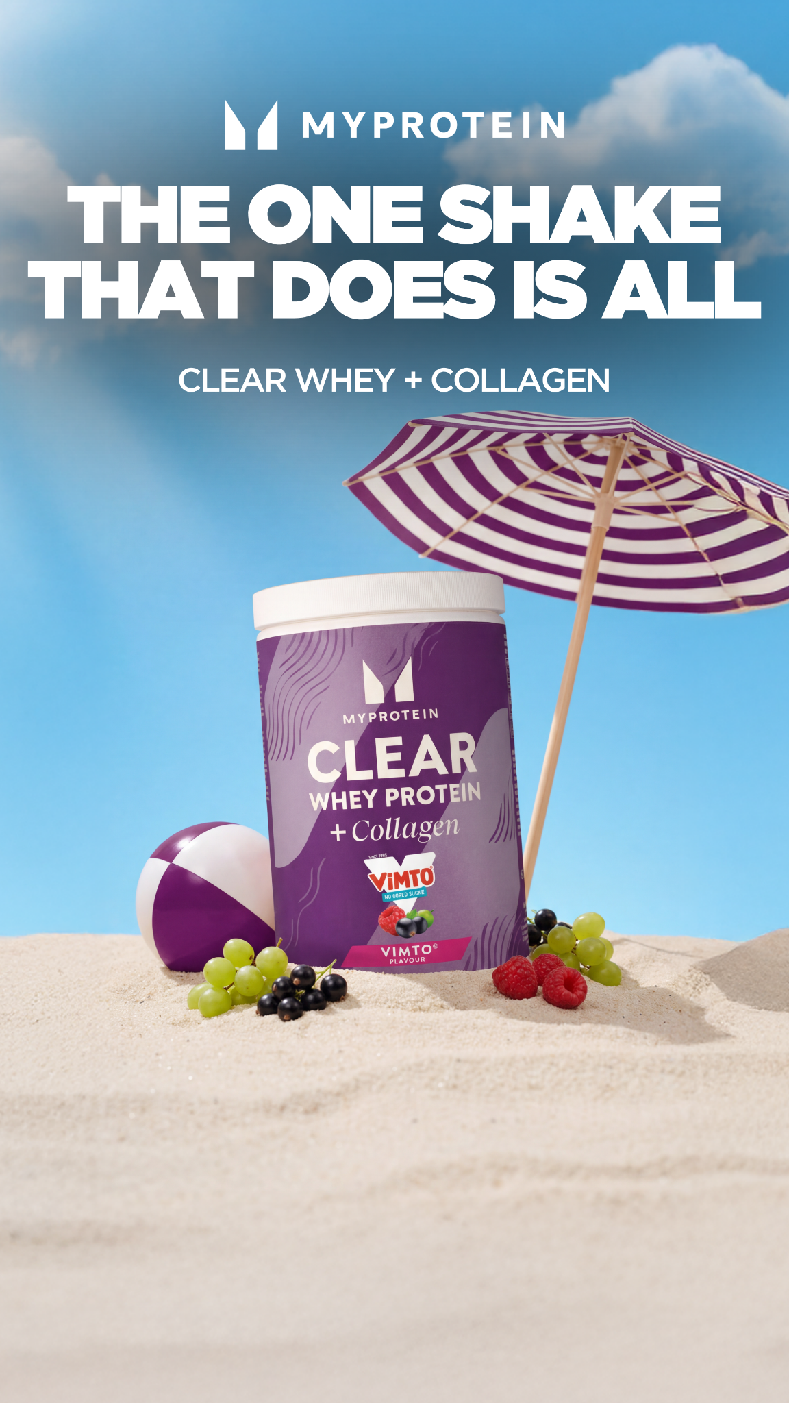 A MyProtein Clear Whey Protein + Collagen tub sits on a sandy beach under a striped umbrella. The tub is purple and features the Vimto flavor. Beside the tub are grapes, raspberries, and a purple and white beach ball. The text "MYPROTEIN" is at the top, followed by the bold headline "THE ONE SHAKE THAT DOES IS ALL" and smaller text "CLEAR WHEY + COLLAGEN" below it. The background is a bright blue sky with fluffy clouds.