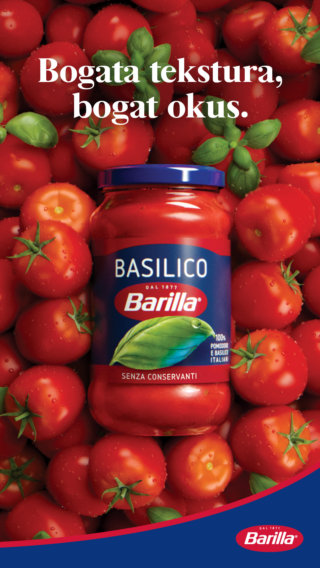A close-up shot of a jar of Barilla Basilico sauce surrounded by fresh, ripe tomatoes and basil leaves. The jar's label is clearly visible, featuring the Barilla logo and "BASILICO DAL 1877". White text overlaid on the image reads "Bogata tekstura, bogat okus." which translates to "Rich texture, rich taste." The overall impression is one of freshness and quality ingredients.