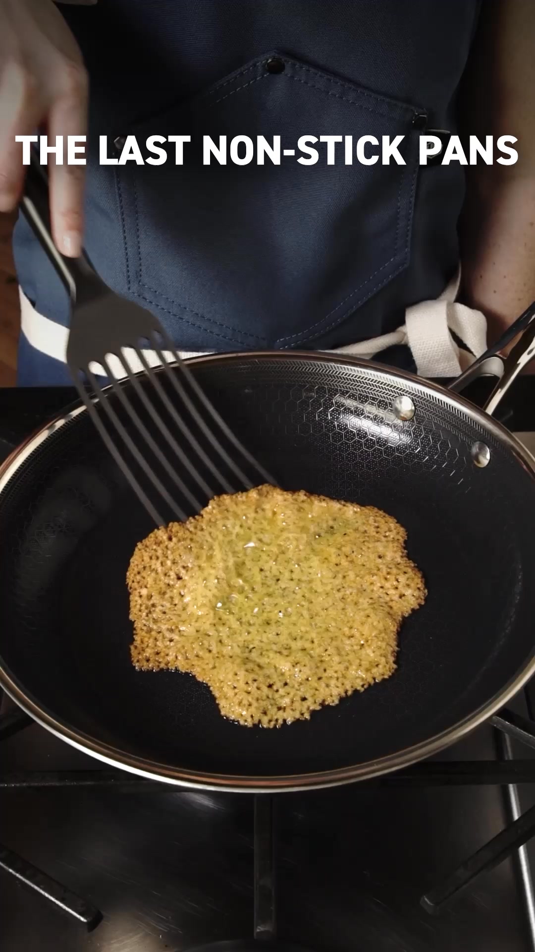 A close-up shot shows a person using a spatula to lift a golden-brown, lacy food item from a black non-stick pan. The pan has a distinctive hexagonal pattern on its surface. White text overlaid on the top left of the image reads "THE LAST NON-STICK PANS". The scene is set over a black stovetop.