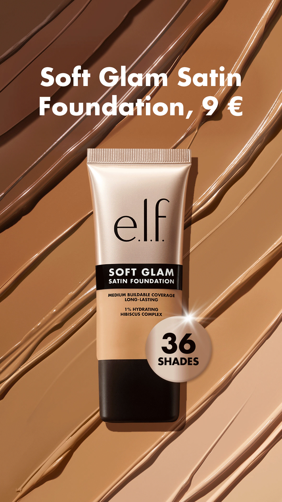 A tube of E.l.f. Soft Glam Satin Foundation is shown against a background of swirled foundation shades. Text on the image reads "Soft Glam Satin Foundation, 9 "," and "36 SHADES". The product packaging also states "SOFT GLAM SATIN FOUNDATION", "MEDIUM BUILDABLE COVERAGE LONG-LASTING", and "1% HYDRATING HIBISCUS COMPLEX". The ad highlights the product's price and the variety of shades available.