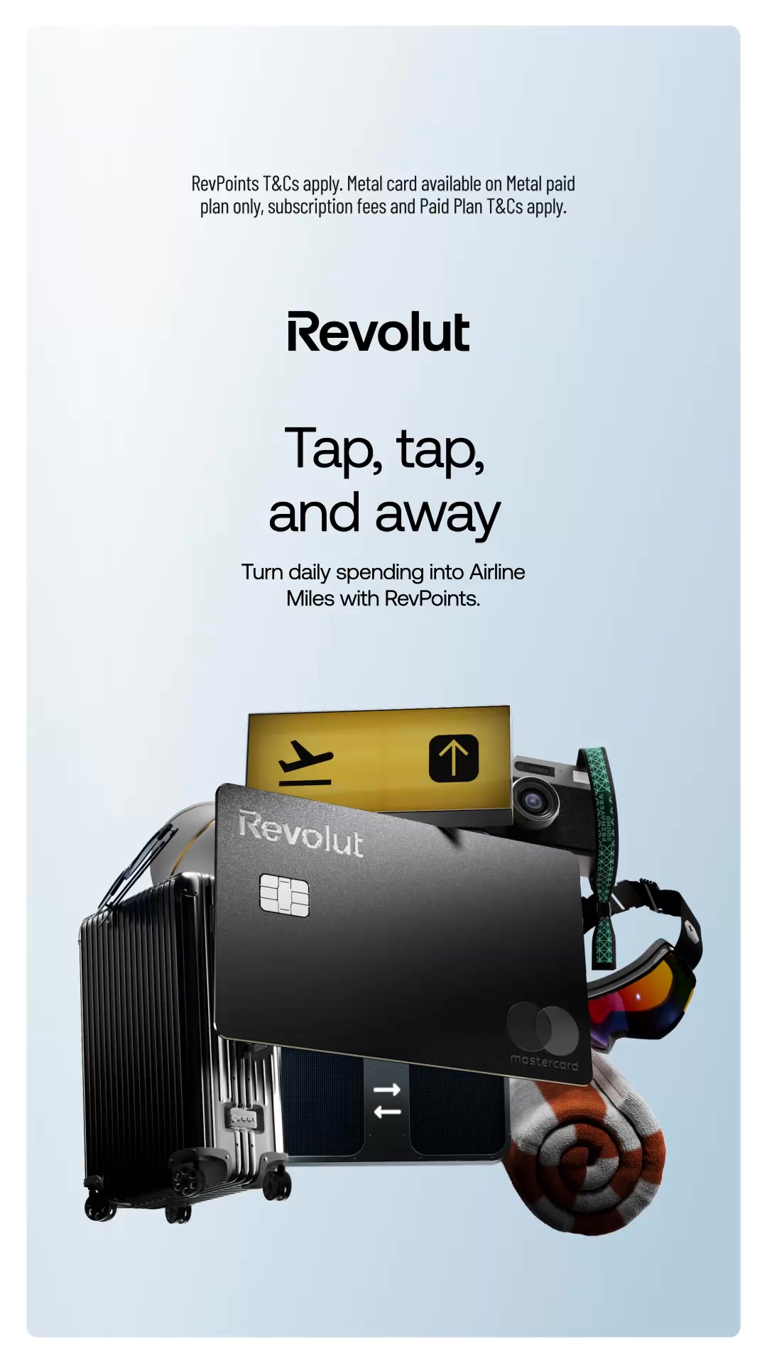 The ad features a Revolut Mastercard and travel items like a suitcase, goggles, and a rolled-up towel, arranged against a light blue gradient background. The text "Revolut" is prominently displayed, followed by the hook "Tap, tap, and away." Below this, it reads, "Turn daily spending into Airline Miles with RevPoints." Smaller text at the top mentions "RevPoints T&Cs apply. Metal card available on Metal paid plan only, subscription fees and Paid Plan T&Cs apply."