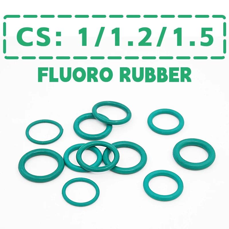 A product shot of several green O-rings scattered on a white background. Text overlays at the top of the image read "CS: 1/1.2/1.5" and "FLUORO RUBBER" in bold green capital letters. The text is enclosed in a dashed green border. The O-rings are the main focus, with some stacked and others spread out. The image highlights the product and its specifications.