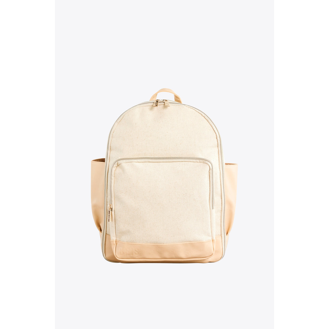 A neutral-colored backpack is shown against a plain background. The backpack is made of a canvas-like material with tan leather accents on the bottom and side pockets. It features a main zippered compartment, a front zippered pocket, and two side pockets. The text "Forget something?" is overlaid on the image in a simple, sans-serif font. The brand name "BEIS" is subtly embossed on the tan leather at the bottom of the backpack.