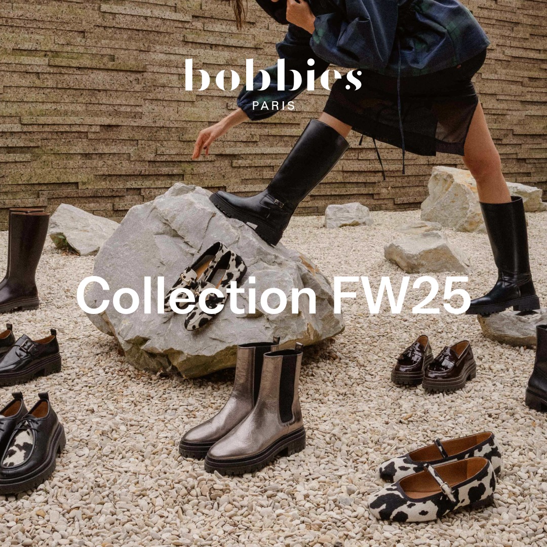 A woman wearing a dark plaid jacket and black skirt is reaching down towards a large rock. She is wearing tall black boots. Several pairs of shoes are displayed on and around the rock, including boots, loafers, and flats, some with a cow print pattern. The text "bobbies PARIS" is at the top of the image, and "Collection FW25" is overlaid in large white font across the lower half of the image. The scene is set outdoors on a gravel path with large stones and a stone wall in the background.