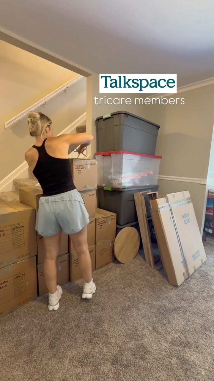 A woman is shown from behind, packing boxes in a stairwell. On-screen text reads "Talkspace tricare members". The hook states, "I am a firm believer and advocate for military families needing more resources available when it comes to mental health." The creative focuses on the personal experience of the creator and the availability of mental health resources for military families.