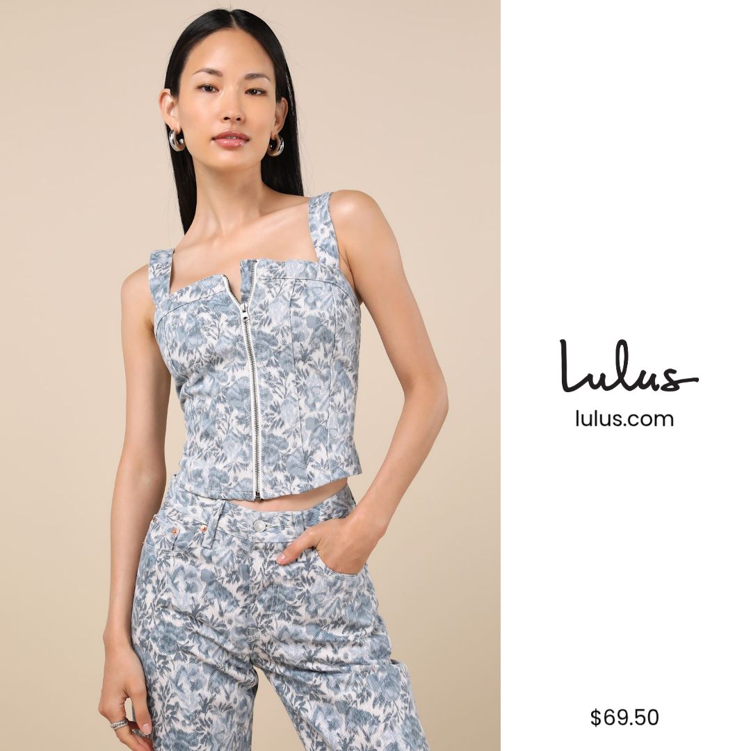 A woman models a blue floral print corset top with a zipper down the front, paired with matching pants. The Lulus logo and website are displayed on the right side of the image, along with the price of $69.50. The copy "we're currently crushing on all of these looks 🖤" is overlaid on the image, suggesting a current fashion trend or collection.