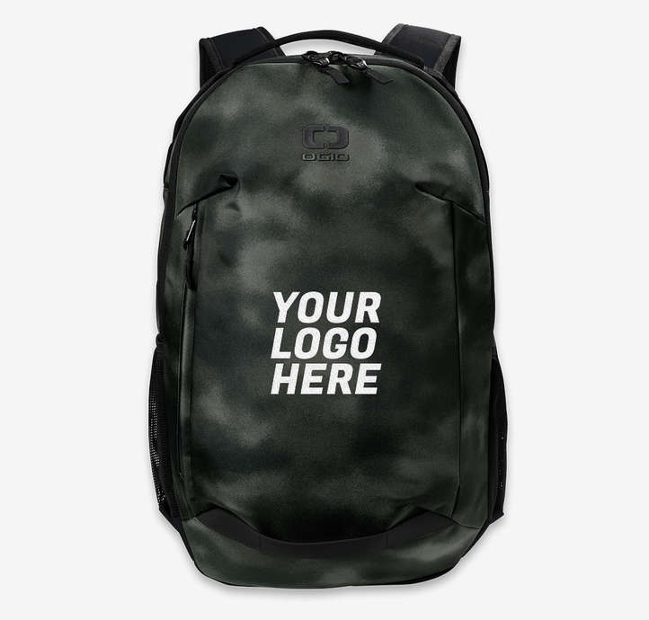 A dark, camouflage-patterned backpack is shown against a plain grey background. White text overlaid on the backpack reads "YOUR LOGO HERE". The copy "Toss it, stow it, go! Choose from a wide variety of durable bag styles at Custom Ink." is present. The creative focuses on the product itself, highlighting its customizable nature with the placeholder text for a logo.