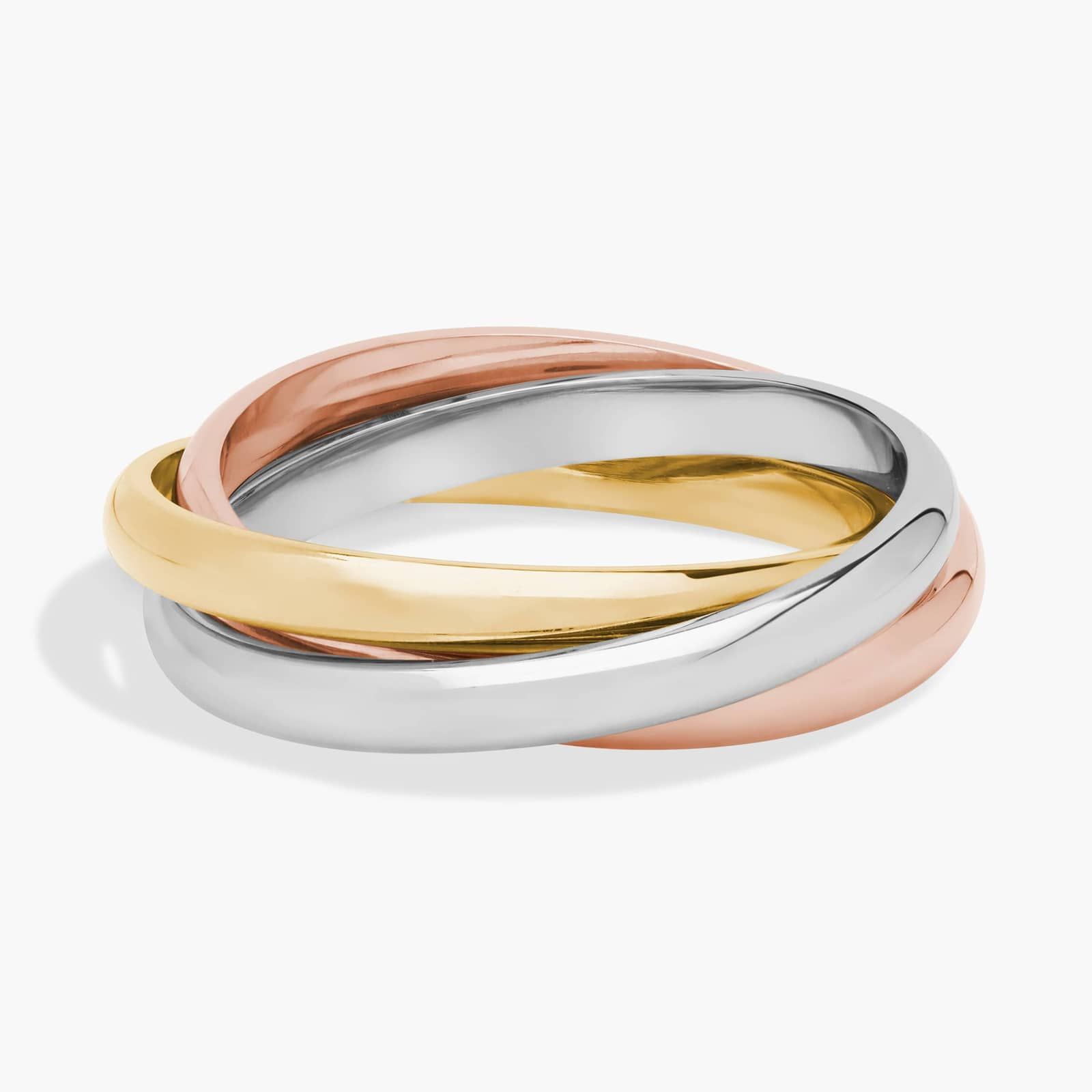 A studio shot of a tri-color ring, featuring intertwined bands of yellow gold, white gold, and rose gold. The lighting is soft, highlighting the polished metal surfaces and the way the bands interlock. The background is a plain, light gray with a subtle shadow cast by the ring. The text "Get up to 30% off* beautifully crafted jewelry made for the season ahead." is overlaid on the image.