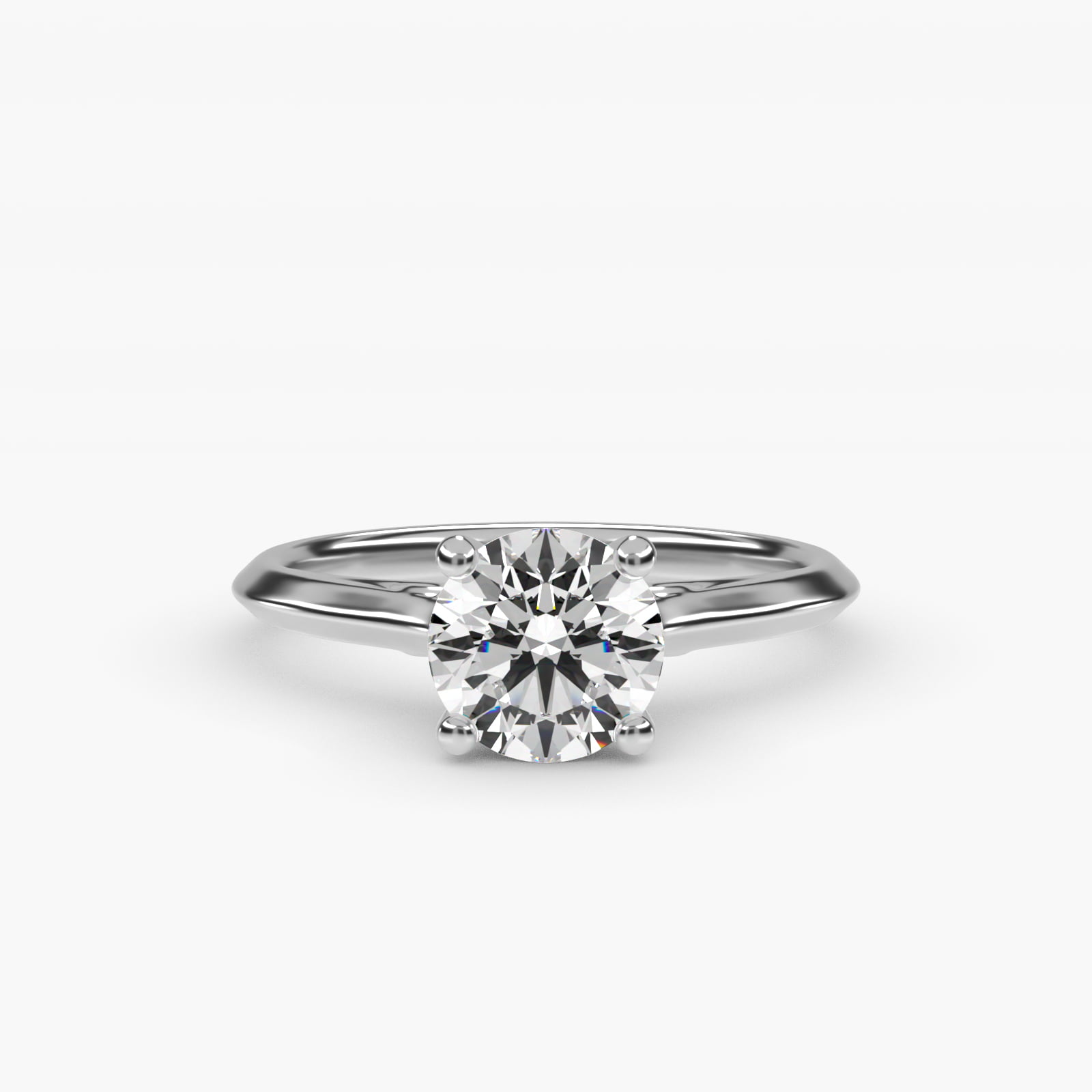 A close-up studio shot of a diamond engagement ring against a plain white background. The ring is silver with a large, round-cut diamond set in four prongs. Text overlaying the image announces a promotion: 'Receive complimentary diamond jewelry with your $1,500+ engagement purchase*, now through October 19.'