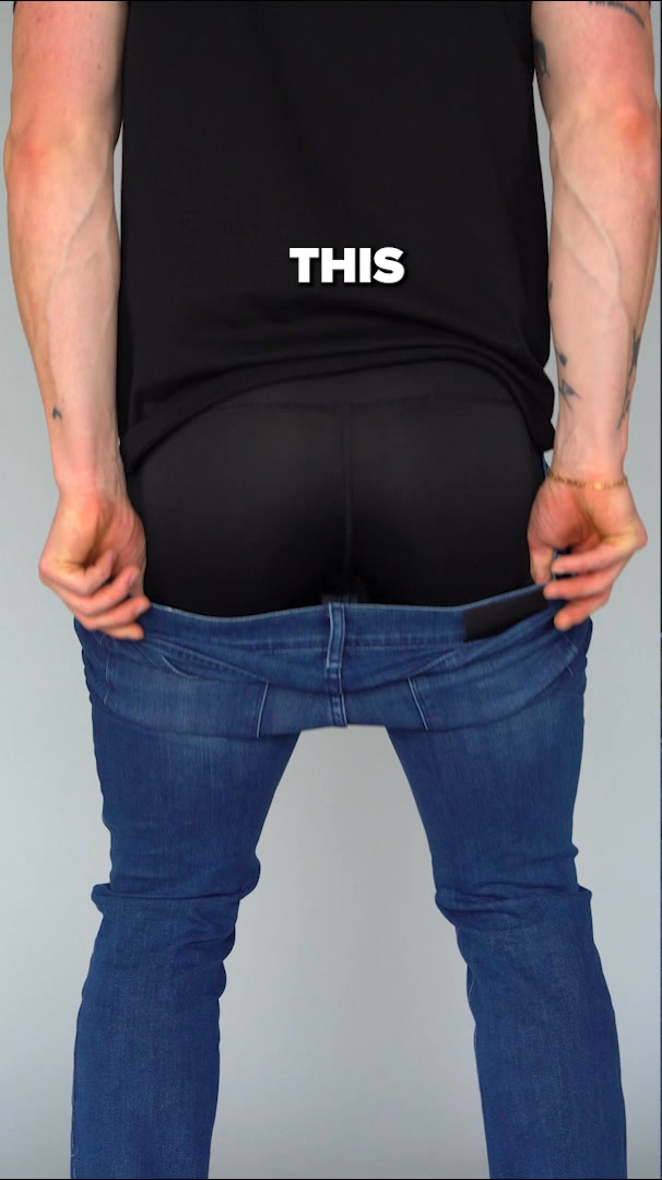 The creative shows the lower half of a person wearing black underwear and blue jeans. The person is pulling down their jeans with both hands. White text overlayed on the image reads "THIS". The image focuses on the fit and appearance of the underwear beneath the jeans.