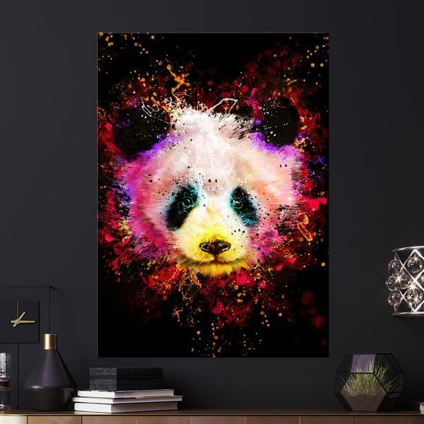 An abstract, vibrant illustration of a panda's face against a black background. Splashes of pink, yellow, red, and blue paint explode outwards from the panda's head, creating a dynamic and energetic effect. The panda's eyes are a striking green, and its nose is a warm yellow. The text overlay asks, "Tired of posters wrinkling, tearing, and fading?" This creative highlights the visual appeal of the artwork while the text addresses a common problem with traditional posters.