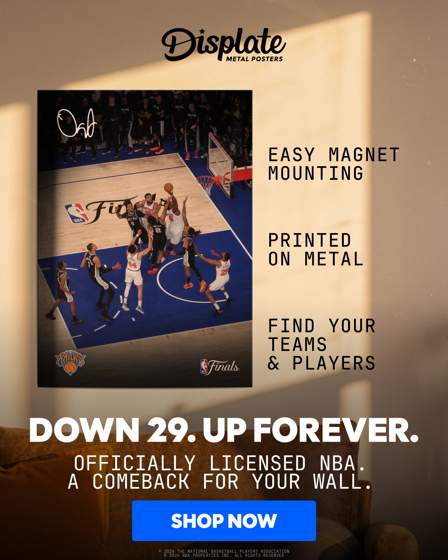A dynamic image showcases a basketball game in progress, with players in action. Text overlays highlight key features: "EASY MAGNET MOUNTING", "PRINTED ON METAL", and "FIND YOUR TEAMS & PLAYERS". Below the image, a bold headline reads "DOWN 29. UP FOREVER." followed by "OFFICIALLY LICENSED NBA. A COMEBACK FOR YOUR WALL." A "SHOP NOW" button is prominently displayed at the bottom.