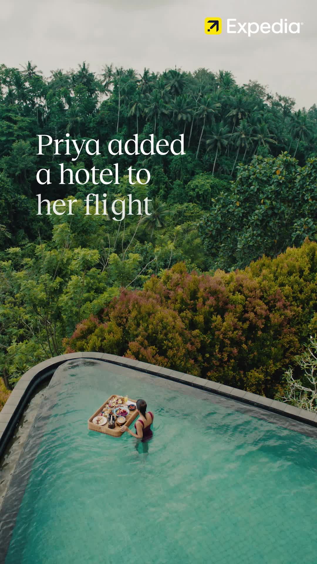 An aerial view shows a woman in a swimming pool with a floating breakfast tray. Lush green trees and palm trees form the background. The text overlay reads "Priya added a hotel to her flight." The Expedia logo is in the top right corner.