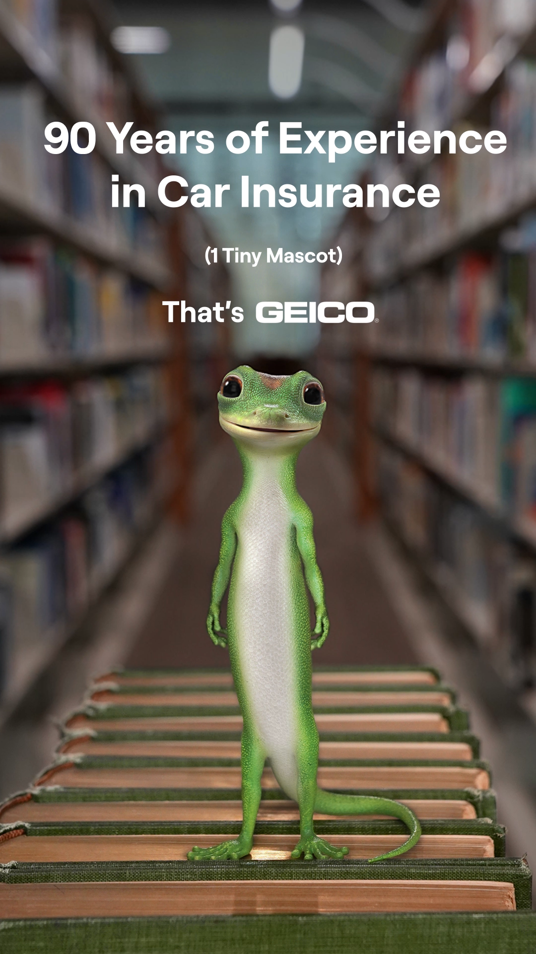 The image features the GEICO gecko standing on a stack of books in a library aisle. Large white text overlays the top of the image, stating "90 Years of Experience in Car Insurance" and "(1 Tiny Mascot)". Below this, it says "That's GEICO." The creative highlights the company's long history and implies expertise in car insurance.