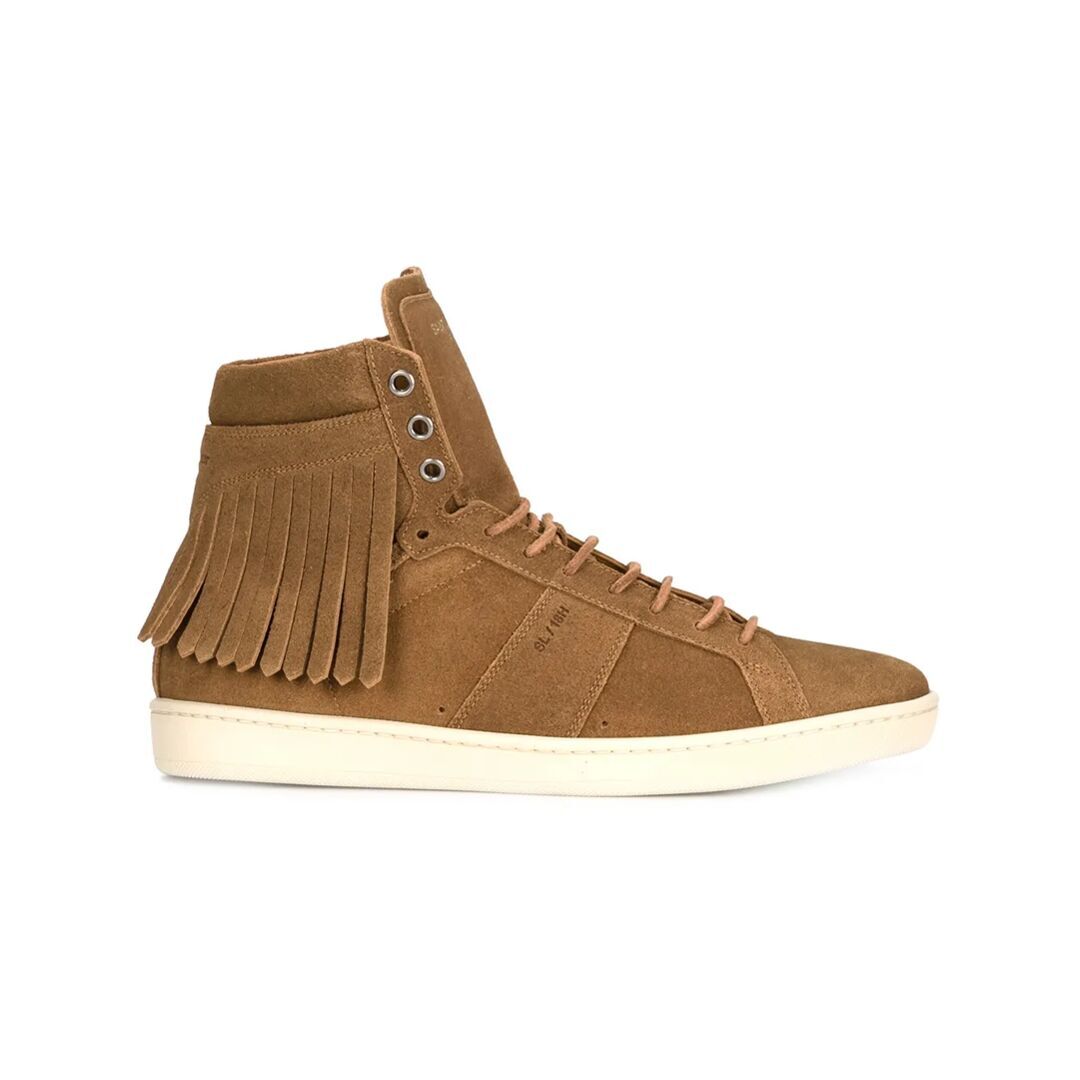 A single, high-top, tan suede sneaker with fringe detailing on the side is shown against a plain white background. The sneaker has white laces and a white sole. The brand name 'SL 18H' is subtly embossed on the side of the shoe near the laces. There is no text or overlay on the image.