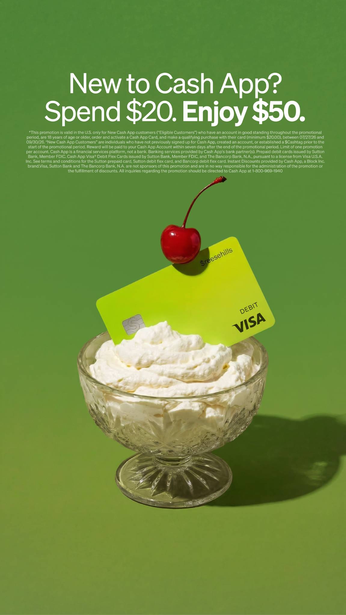 A bright green Cash App debit card is presented upright in a clear glass bowl filled with whipped cream, resembling a dessert. A bright red cherry with a stem sits atop the card, completing the dessert illusion. The text "New to Cash App? Spend $20. Enjoy $50." is prominently displayed in white, sans-serif font against a green background. Below the main text, smaller white font details the promotion's terms and conditions.
